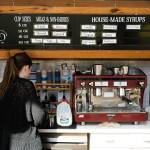 An employee makes a cup of coffee at Choux Choux Bakery on Thursday, June 18, 2026, in Everett, Washington. (Will Geschke / The Herald)