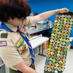 Skyler MacKay shows his merit badges on Wednesday, June 17, 2026, in Lynnwood, Washington. (Will Geschke / The Herald)