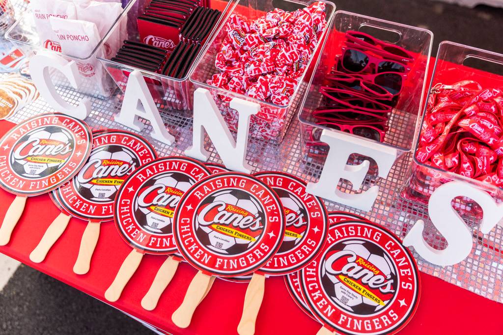Free Raising Canes themed swag available during the grand opening on Tuesday, June 23, 2026 in Lynnwood, Washington. (Olivia Vanni / The Herald)