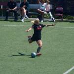 Snohomish Uniteds Ally Laccinole sends a free kick toward the Salmon Bay FC box from behind the midfield line during Snohomishs 2-1 loss at Interbay Soccer Stadium on June 28, 2026. (Joe Pohoryles / The Herald)