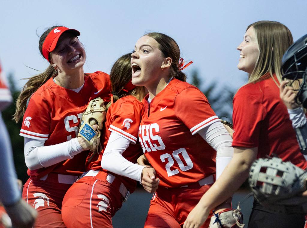 Stanwoods Addi Anderson celebrates with her teammates after beating Monroe on Thursday, May 1, 2025 in Monroe, Washington. (Olivia Vanni / The Herald)