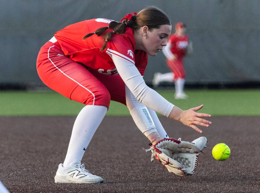 Stanwoods Addi Anderson picks up a bunt during the game against Monroe on Thursday, May 1, 2025 in Monroe, Washington. (Olivia Vanni / The Herald)