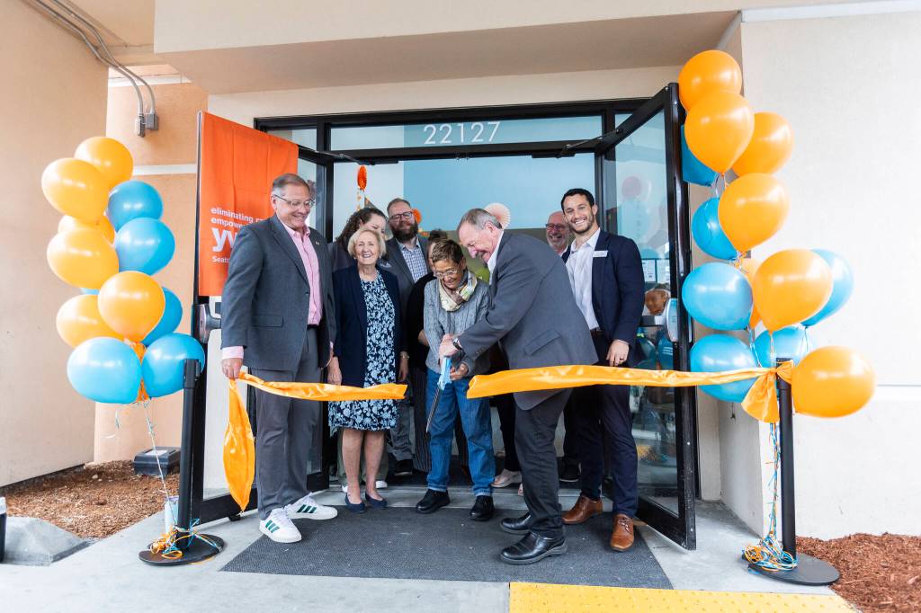 YWCA CEO Maria Chavez-Wilcox and Snohomish County Executive Dave Somers along with other community members cut the ribbon at the Edmonds New Start Center opening ceremony on Monday, June 29, 2026, in Edmonds, Washington. (Olivia Vanni / The Herald)