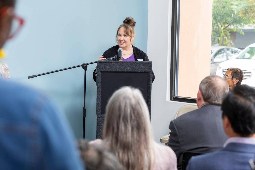 YWCA Board Member Mindy Woods speaks about her experience staying at the facility that occupied the space of what is the the Edmonds New Start Center on Monday, June 29, 2026, in Edmonds, Washington. (Olivia Vanni / The Herald)