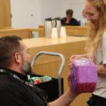 Recovery Court Coordinator Luke Emerson and participant Rayna Adair celebrate one of Adairs recent achievements by picking from a prize jar during an afternoon session of drug court at the Snohomish County Superior Courthouse on Thursday, June 18, 2026, in Everett, Washington. (Ian Davis-Leonard / The Daily Herald)