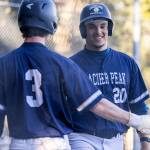 Glacier Peaks Emmett Brown high-fives Matthew Marquardt after scoring during the game against Meadowdale on Wednesday, April 8, 2026 in Lynnwood, Washington. (Olivia Vanni / The Herald)