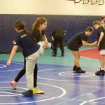 Campers practice wrestling moves during the Kamiak girls Kamiak girls wrestling camp at Mariner High School on June 30, 2026. (Joe Pohoryles / The Herald)