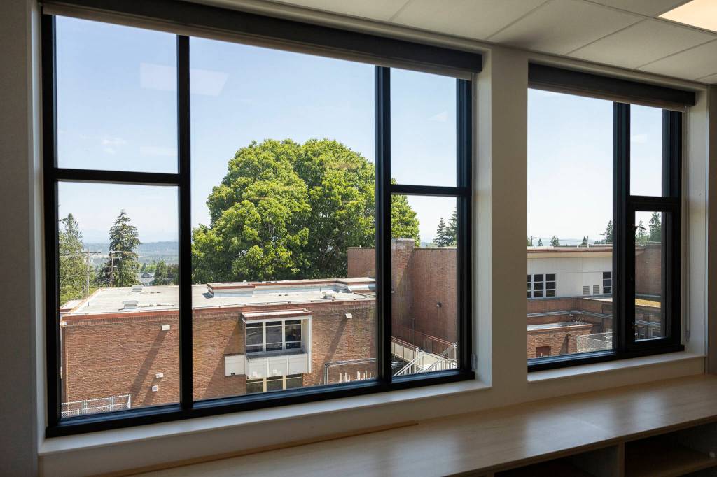 A view of the old Jackson Elementary School from the second floor of the new Jackson Elementary School building on Tuesday, July 7, 2026, in Everett, Washington. (Olivia Vanni / The Herald)