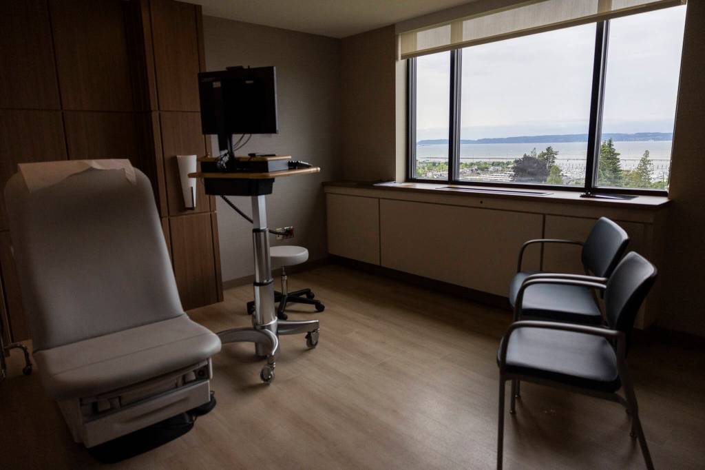 Inside on of the infusion rooms with a view of Jetty Island at the infusion center at Providence Regional Medical Center Everett on Thursday, July 2, 2026, in Everett, Washington. (Olivia Vanni / The Herald)