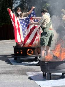Members of Lake Stevens Scouting America Troop 36 retire a U.S. flag on Flag Day, June 14, 2026, as they do every year. This was one of over 200 flags they retired this year. (Provided photo)