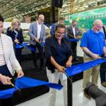 Everett Mayor Cassie Franklin along with other Boeing and Snohomish County officials cut the ribbon Friday for the North Line, where Boeing will manufacture the 737 MAX in Everett for the first time in Everett, Washington. (Olivia Vanni / The Herald)