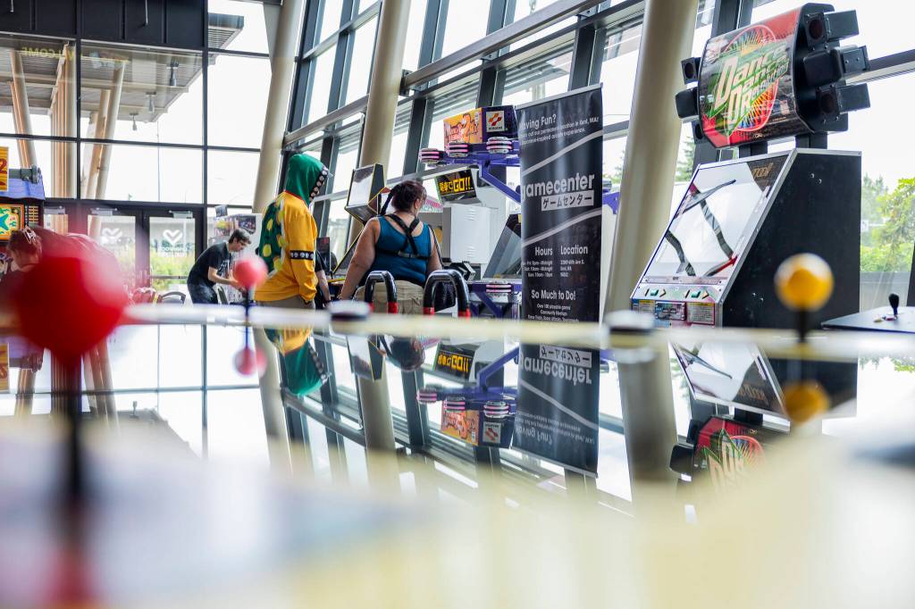 People explore the Game Center during GeekFest West on Friday, July 17, 2026, in Lynnwood, Washington. (Olivia Vanni / The Herald)