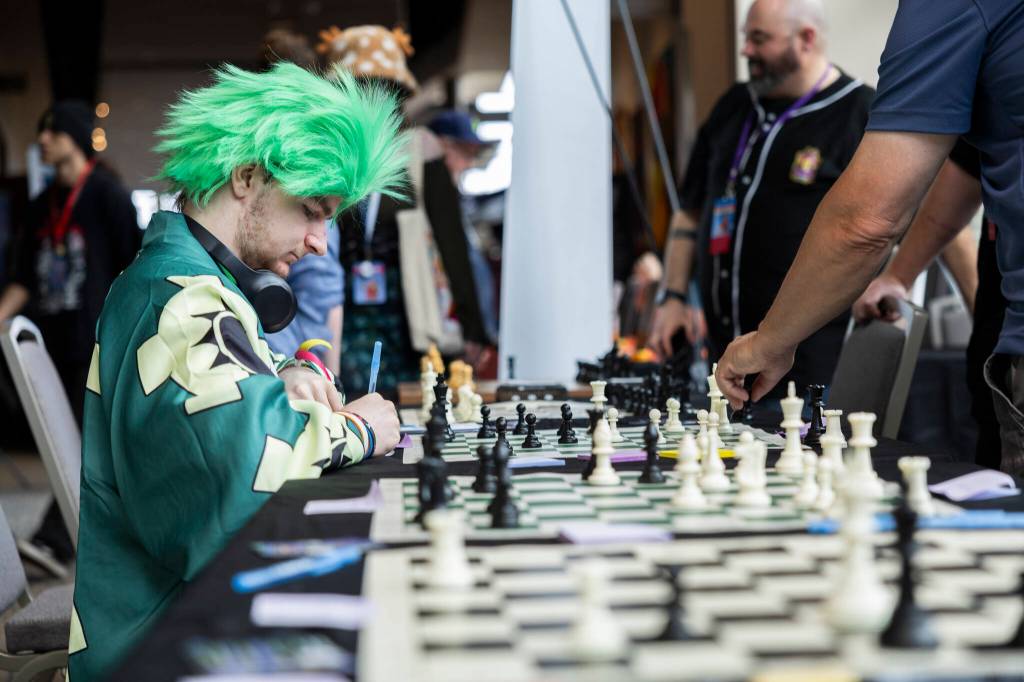 Truman LeMay plays chess during GeekFest West on Friday, July 17, 2026, in Lynnwood, Washington. (Olivia Vanni / The Herald)
