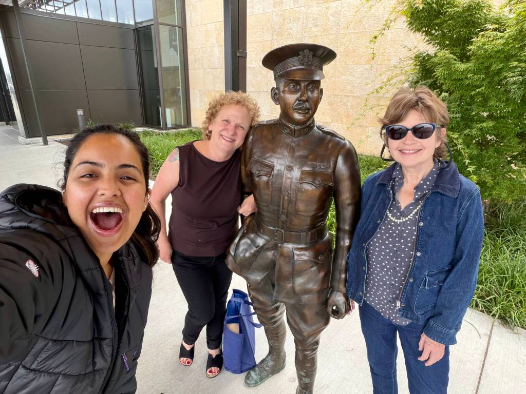 Left to right, Sumiran Nigam, Andrea Brown, Lt. Topliff Olin Paine and Janice Podsada in front of the Paine Field terminal. (Sumiran Nigam / The Herald)