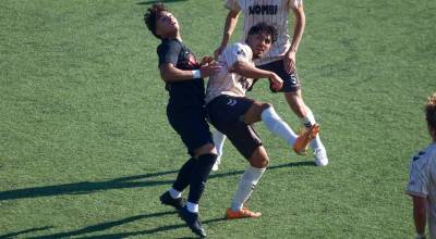 Snohomish Uniteds Edgar Leon (left) jumps for a ball in the air during a 4-0 loss to Ballard FC at Interbay Soccer Stadium on July 12, 2026. (Joe Pohoryles / The Herald)