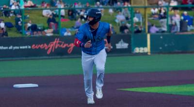 AquaSox infielder Austin St. Laurent runs to third base during Everetts 6-3 win against the Tri-City Dust Devils at Everett Memorial Stadium on July 4, 2026. (Joe Pohoryles / The Herald)