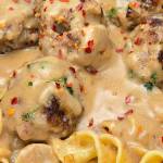 These homemade meatballs are seasoned with garlic, onion, nutmeg, and allspice before being baked until tender and finished in a rich, creamy gravy made completely from scratch. (Roy Mosby)