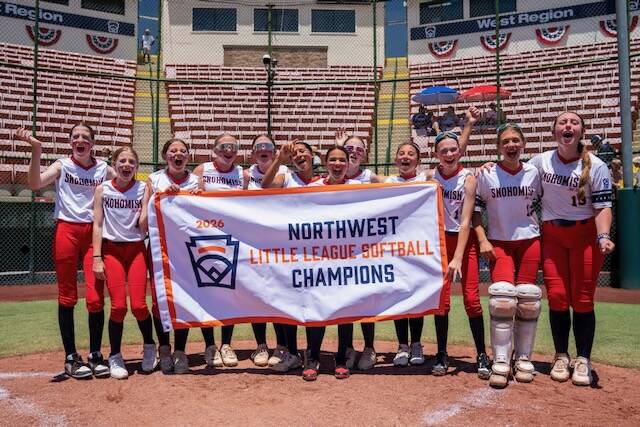 The Snohomish Little League All-Stars hold the Northwest Region championship banner on Thursday at Al Houghton Stadium in San Bernardino, California. (Photo courtesy of Little League Baseball and Softball)