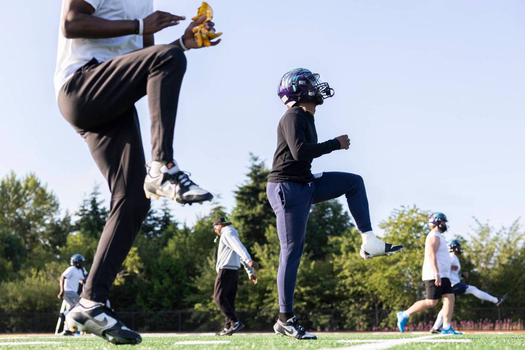 Washington Wolfpack players warm up before starting practice on Friday, July 24, 2026 in Everett, Washington. (Olivia Vanni / The Herald)