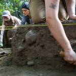 Kennedy Nelson smiles while digging on Tuesday, July 28, 2026 in Mukilteo, Washington. (Olivia Vanni / The Herald)