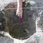 A leather jacket uncovered in one of the sites is pointed out on Tuesday, July 28, 2026 in Mukilteo, Washington. (Olivia Vanni / The Herald)