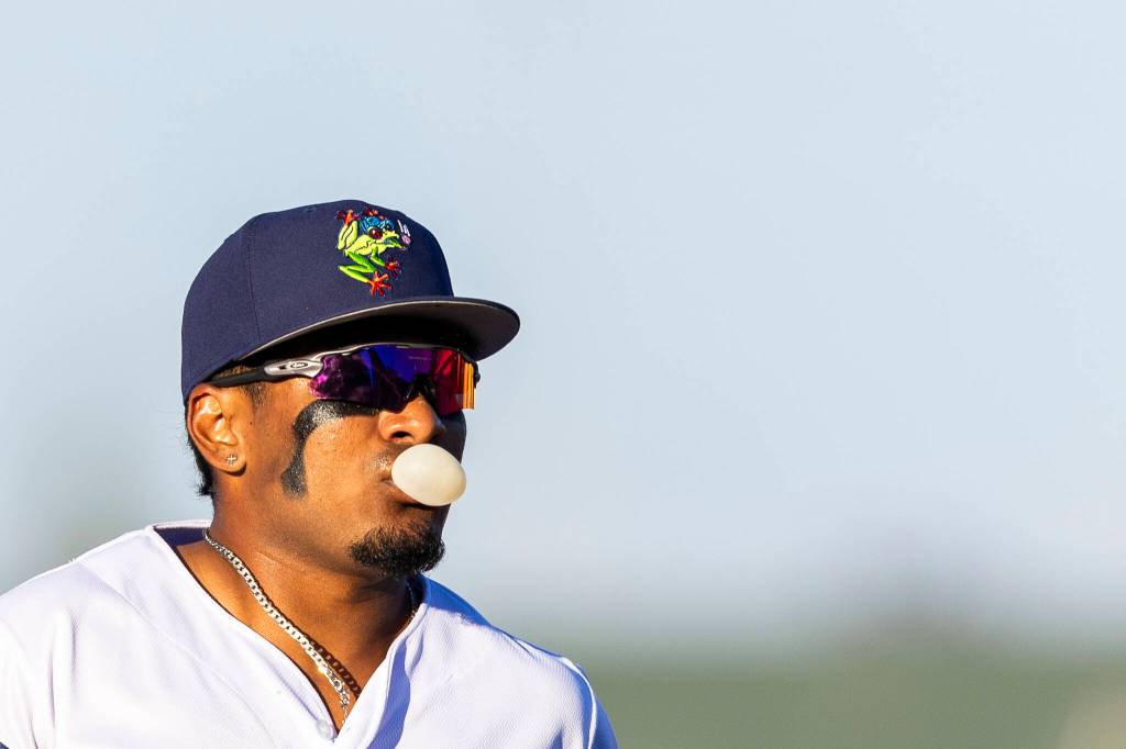 Ricardo Cova #1 of the Everett AquaSox blows a bubble while running in from the outfield during the game against the Eugene Emeralds on Friday, July 24, 2026 in Everett, Washington. (Olivia Vanni / The Herald)