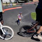 Over 50 bikers and a handful of people on scooters make their way through the Jensen Park pump track on Wednesday, July 29, 2026, in Arlington, Washington. (Olivia Vanni / The Herald)