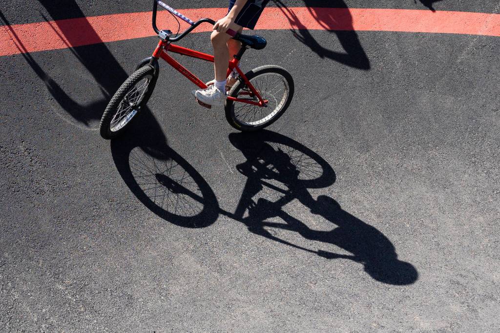 A cyclist maneuvers around a bend in the Jensen Park pump track on Wednesday, July 29, 2026m in Arlington, Washington. (Olivia Vanni / The Herald)