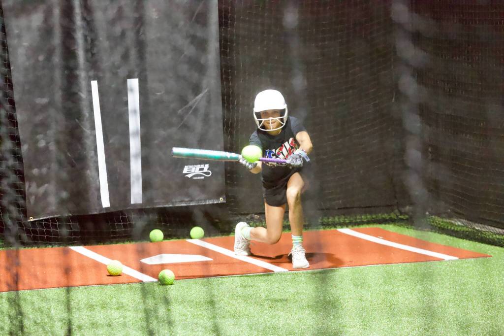 Janessa Malone practices bunting during the Snohomish All-Stars practice at the Blast Barn in Snohomish on July 28, 2026. (Joe Pohoryles / The Herald)