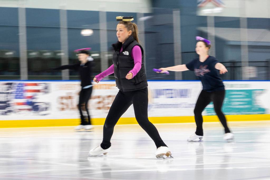 Aspire skaters work on an balance exercise during class at Angel of the Winds Arena Community Ice Rink on Wednesday, July 29, 2026, in Everett, Washington. (Olivia Vanni / The Herald)