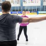Aspire skater Maya Metin takes instructions during class at Angel of the Winds Arena Community Ice Rink on Wednesday, July 29, 2026 in Everett, Washington. (Olivia Vanni / The Herald)
