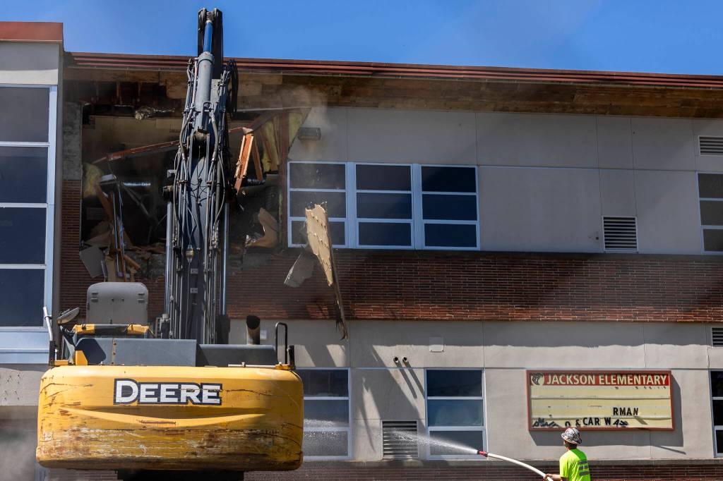 The outer wall of Jackson Elementary School is demolished on Thursday, July 30, 2026 in Everett, Washington. (Olivia Vanni / The Herald)