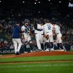 Seattle Mariners manager Dan Wilson (left) visits the mound to remove Seranthony Domínguez (glove at face) during an 8-0 loss to the Detroit Tigers at T-Mobile Park in Seattle, Washington on Tuesday, August 4, 2026. (Photo courtesy of Mason Coe)