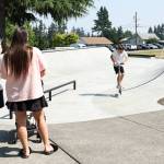 Children enjoy the new skate dot at Lions Park on Thursday, Aug. 6, 2026 in Everett, Washington. (Olivia Vanni / The Herald)