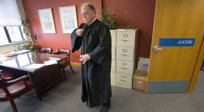 Snohomish County Superior Court Judge Thomas Wynne preparing for a court hearing before his retirement on on December 12, 2016 in Everett, Washington. (Andy Bronson / The Herald)