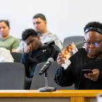 Marika Sapp shows a photograph her cousin, Porsha Sapp, while speaking during the sentencing of William Russell-Leonard at the Snohomish County Courthouse on Tuesday, Aug. 11, 2026 in Everett, Washington. (Olivia Vanni / The Herald)