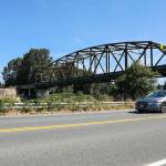 A car drives along Lowell-Snohomish River Road passing underneath Highway 9 on Monday, Aug. 10, 2026 in Snohomish, Washington. (Olivia Vanni / The Herald)