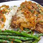 French Onion Smothered Pork Chops are a comforting steakhouse-inspired dinner thats surprisingly easy to make at home. (Roy Mosby)
