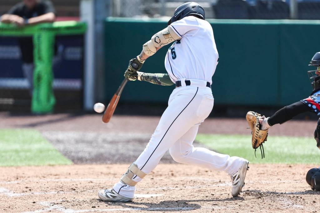 Korbyn Dickerson #5 of the Everett AquaSox hits a two-run home run during the game against the Spokane Indians on Thursday, Aug. 13, 2026 in Everett, Washington. (Olivia Vanni / The Herald)